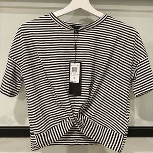 NWT. Black and white striped blouse. Never worn.
